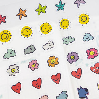 Sheet of clear planner stickers with sun, cloud, star, flower, and heart icons