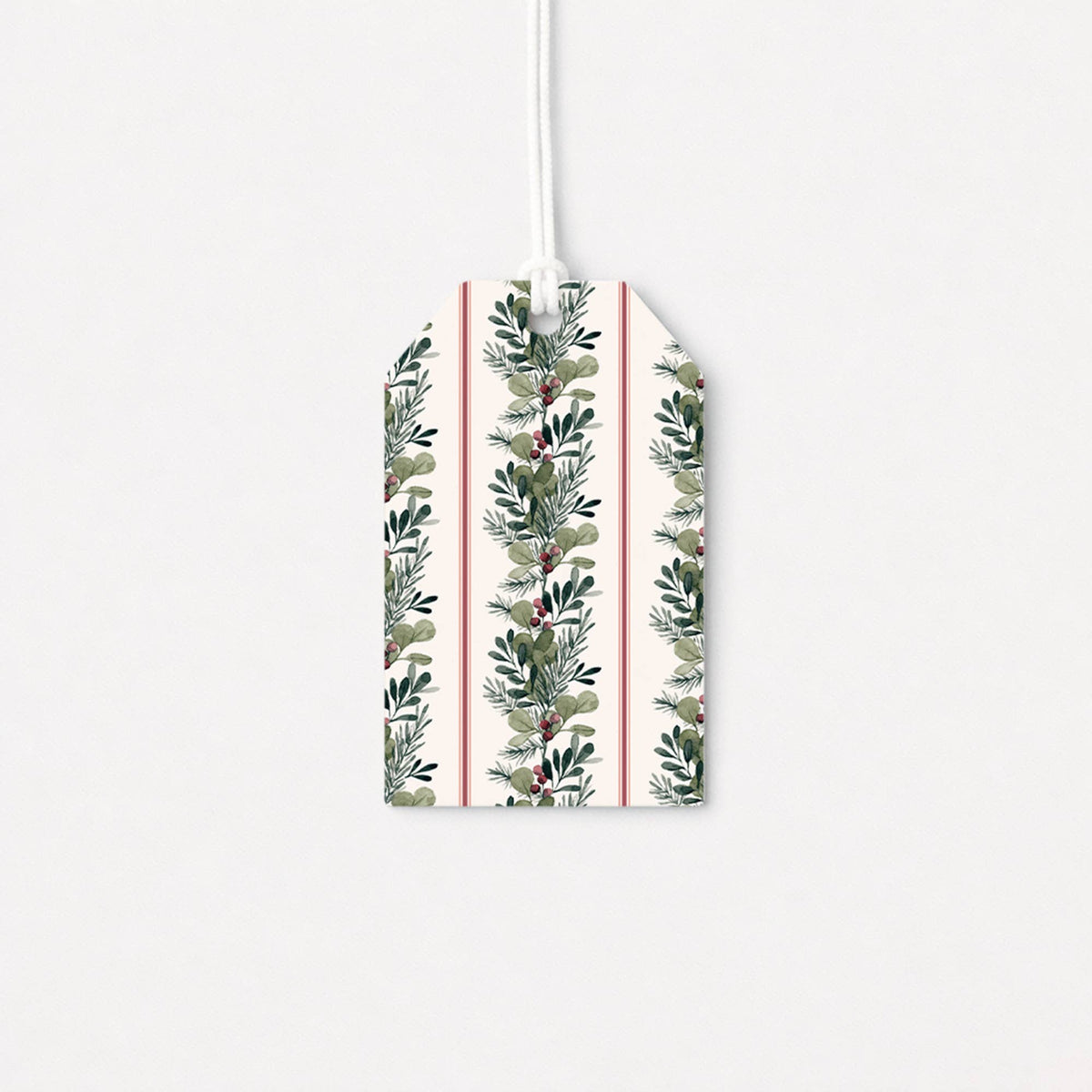 Christmas gift tag with green leafy sprigs and berries print, attached white string