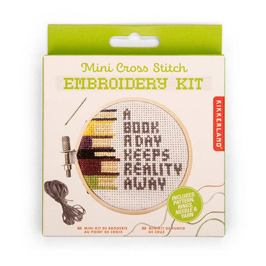 Mini cross-stitch embroidery kit in a retail box with round hoop and floss