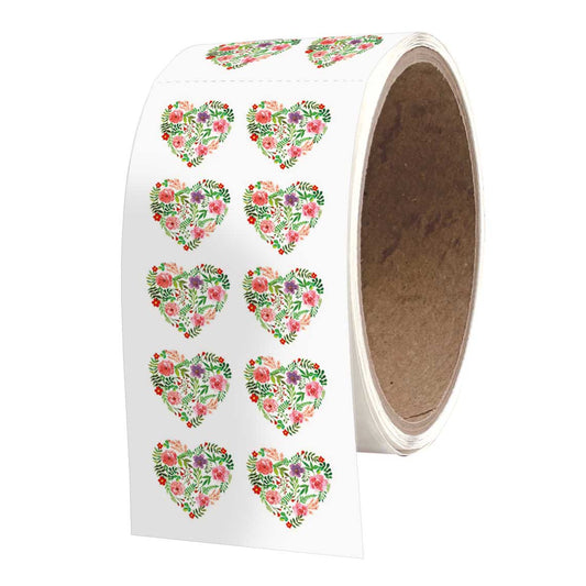 Roll of white decorative heart stickers with pink and green floral designs