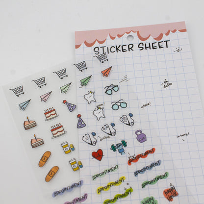 Clear planner sticker sheet with small icons like carts, food, hearts, and glasses