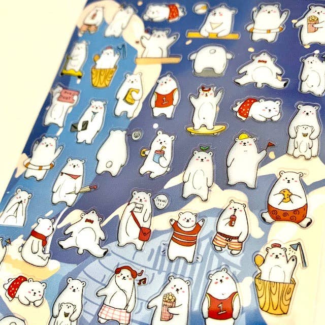 Sheet of polar bear stickers featuring assorted poses and accessories, close-up