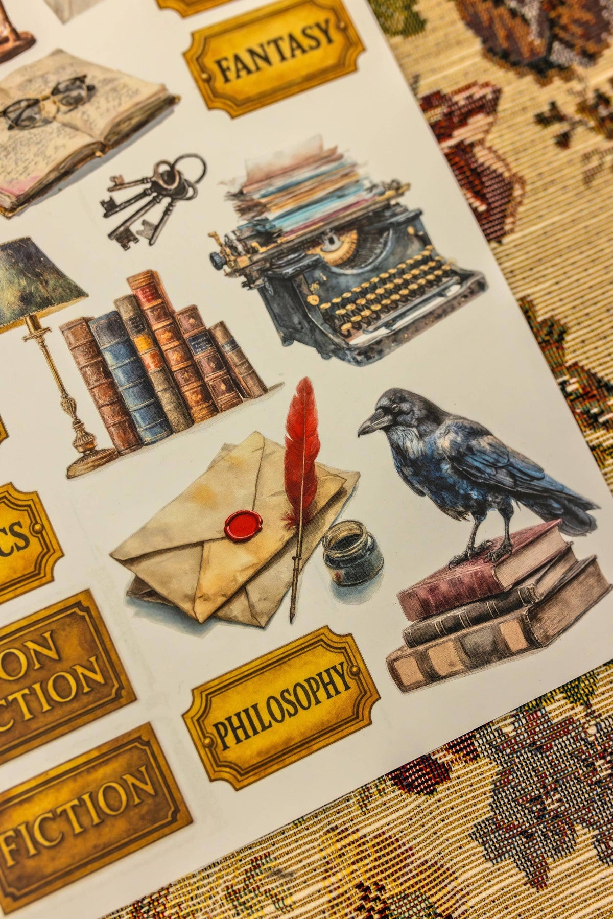 Library sticker sheet with books, envelopes, typewriter, raven, and gold topic labels