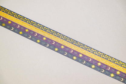 Foiled decorative tape strips with star and vine pattern in gold and purple