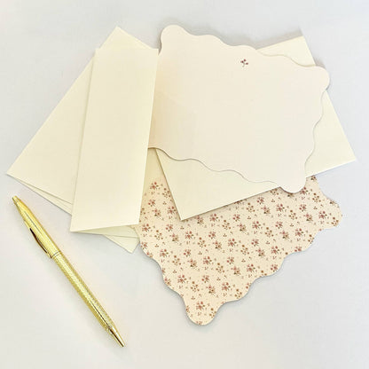 Set of cream envelopes with ditsy floral inner envelope, scalloped edges