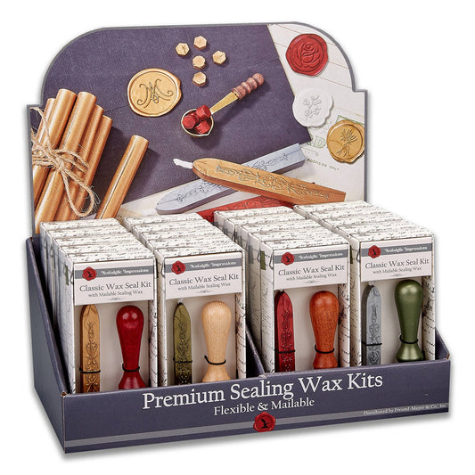 Compact wax seal kit display with boxes, sealing stamps, and wax sticks