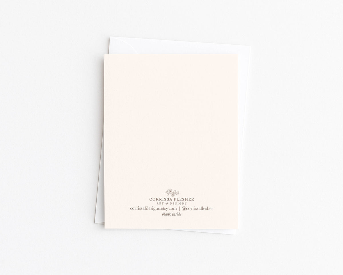 Greeting card back with small printed details and brand/contact text at bottom