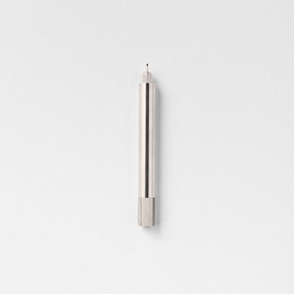 Stainless steel fountain pen with textured grip section and pointed tip