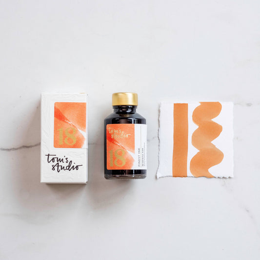 Marmalade fountain pen ink bottle with orange ink swatch and box