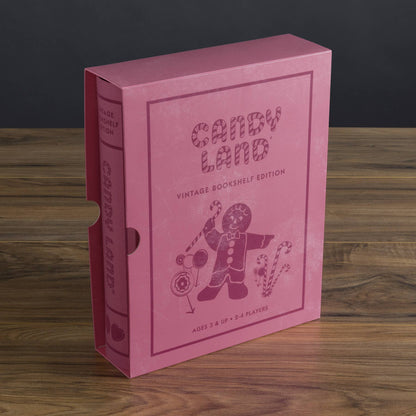 Book-shaped Candy Land box in pink with vintage bookshelf edition title