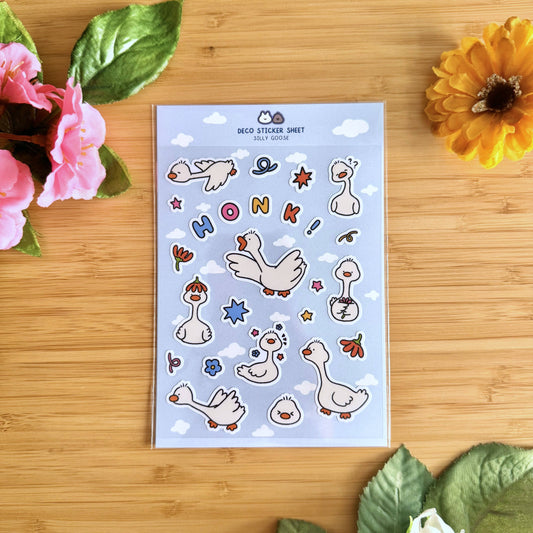 Blue deco sticker sheet with cartoon geese, stars, hearts, and colorful “HONK” letters