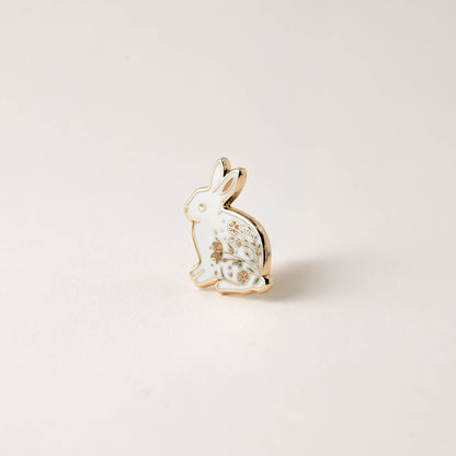 Rabbit enamel pin with gold border and white face, floral garden artwork