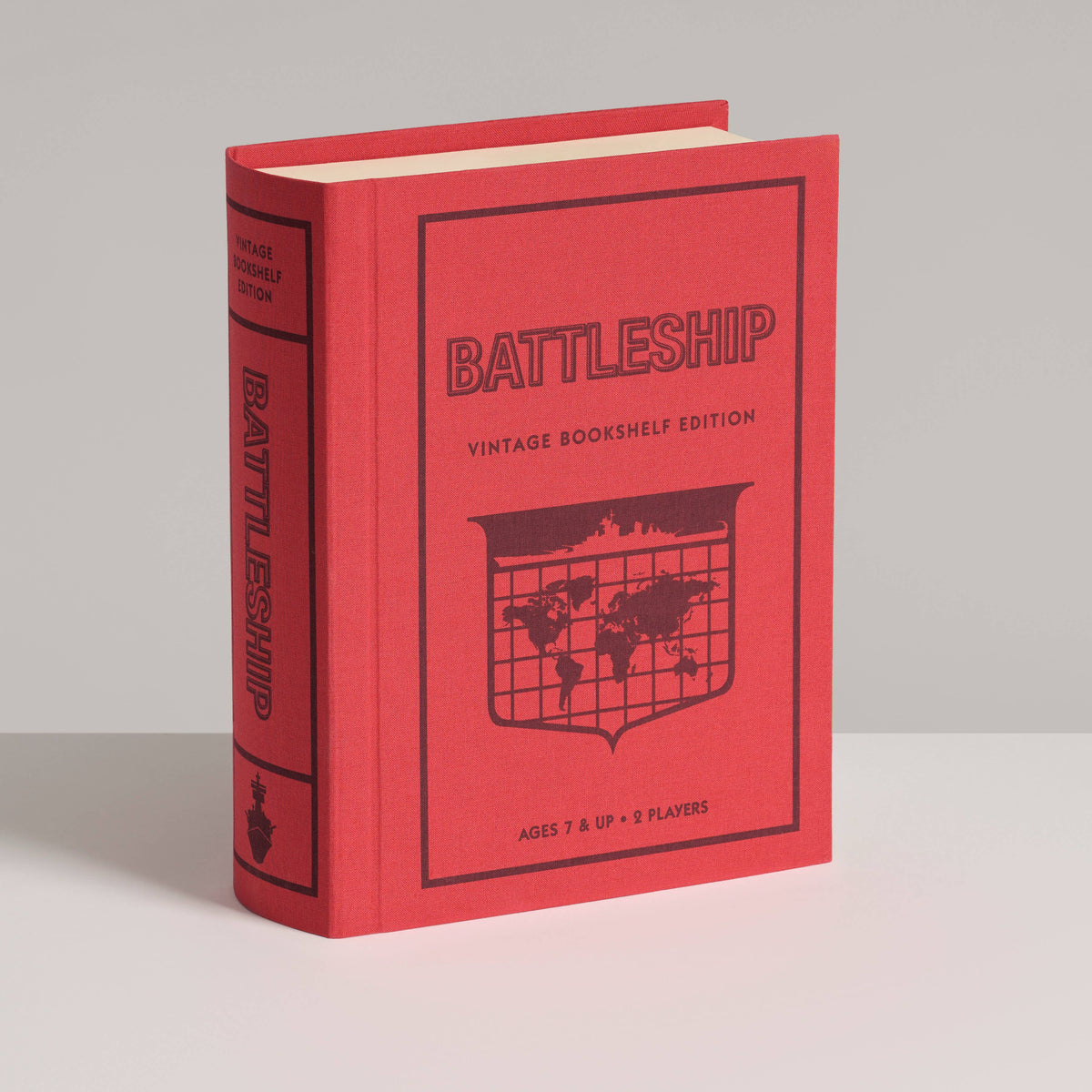 Red bookshelf-style Battleship game box with vintage logo and ship grid cover