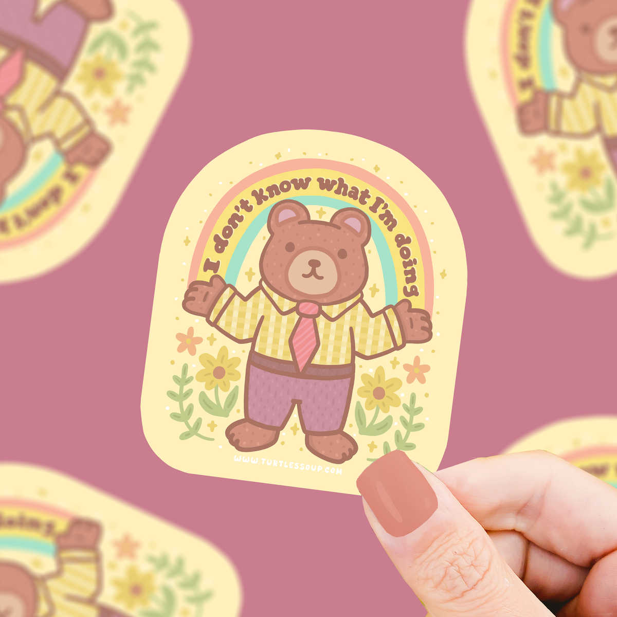 Brown bear vinyl sticker with yellow plaid shirt and flowers, round badge style