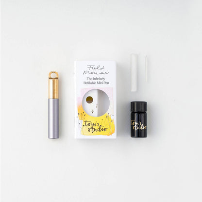 Refillable travel pen set: light purple pen with gold clip, plus refill bottle and box