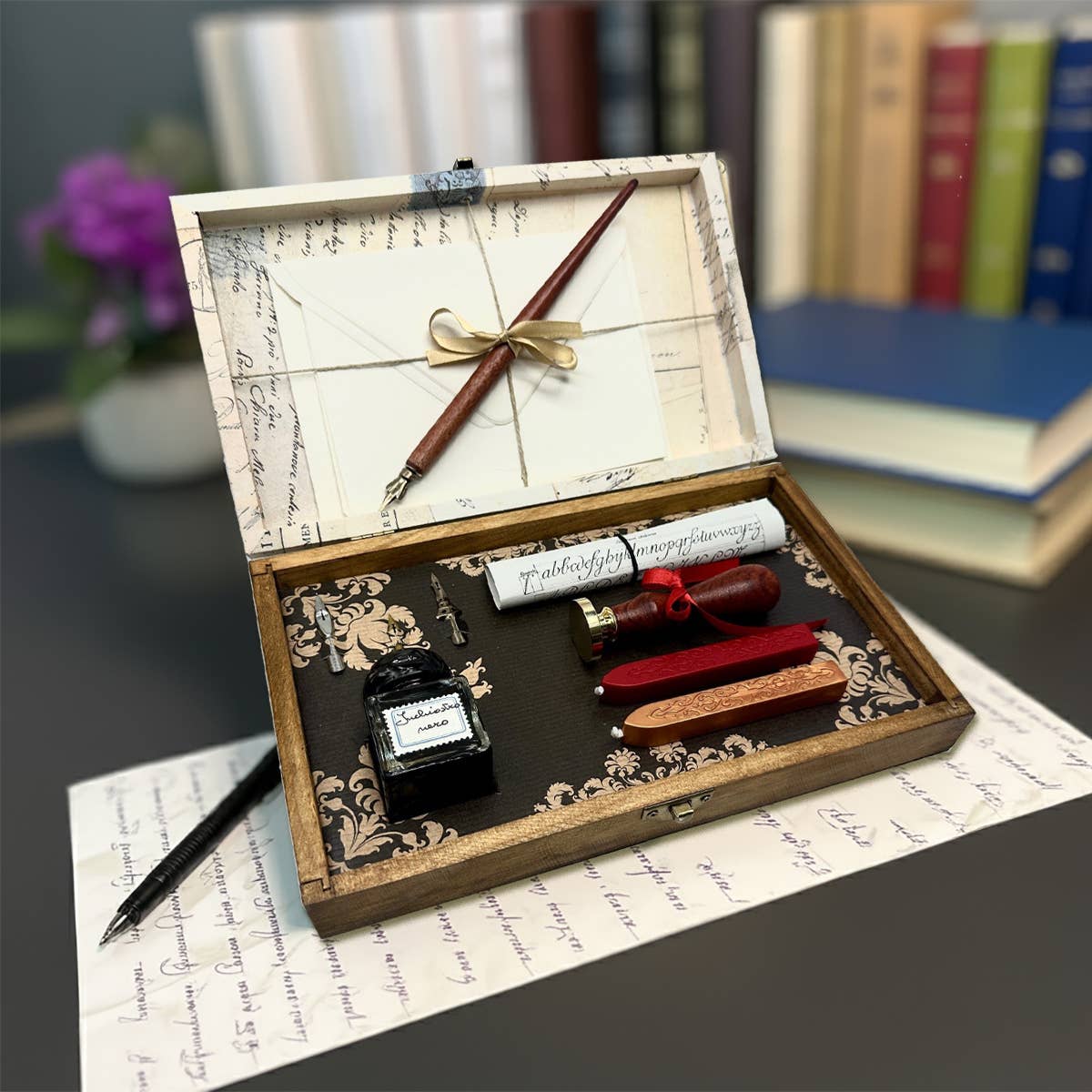 Wax seal kit in wooden box with calligraphy pen, ink pad, wax tools, and seal stamp