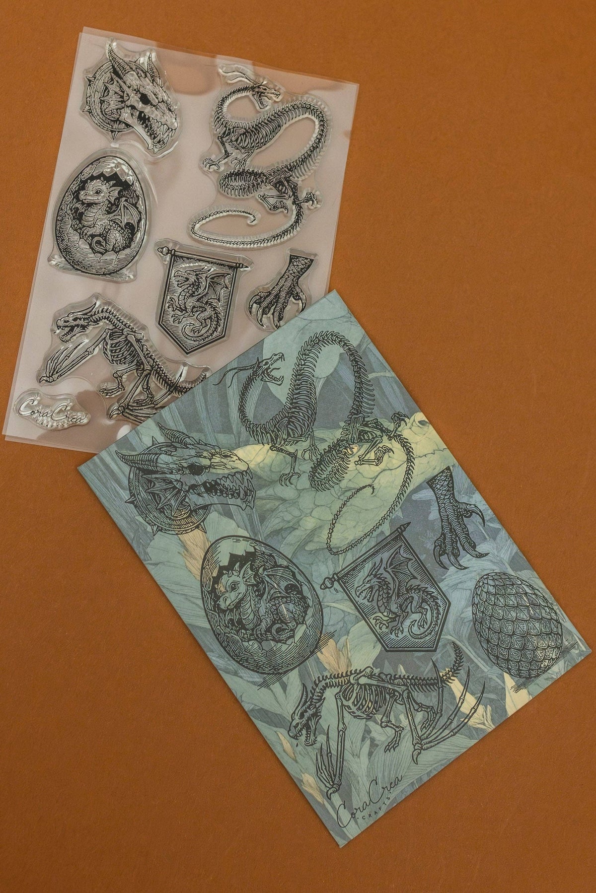 Clear stamp set with embossed dragon and sea creature designs on transparent sheets