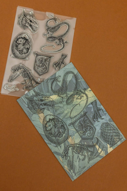 Clear stamp set with embossed dragon and sea creature designs on transparent sheets