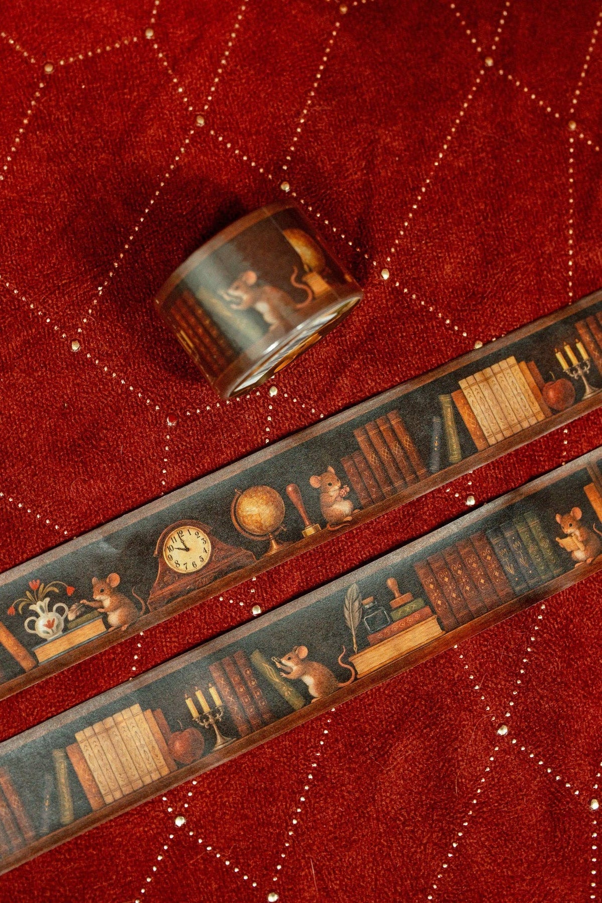 Washi tape strip with vintage clocks and books pattern, plus small roll