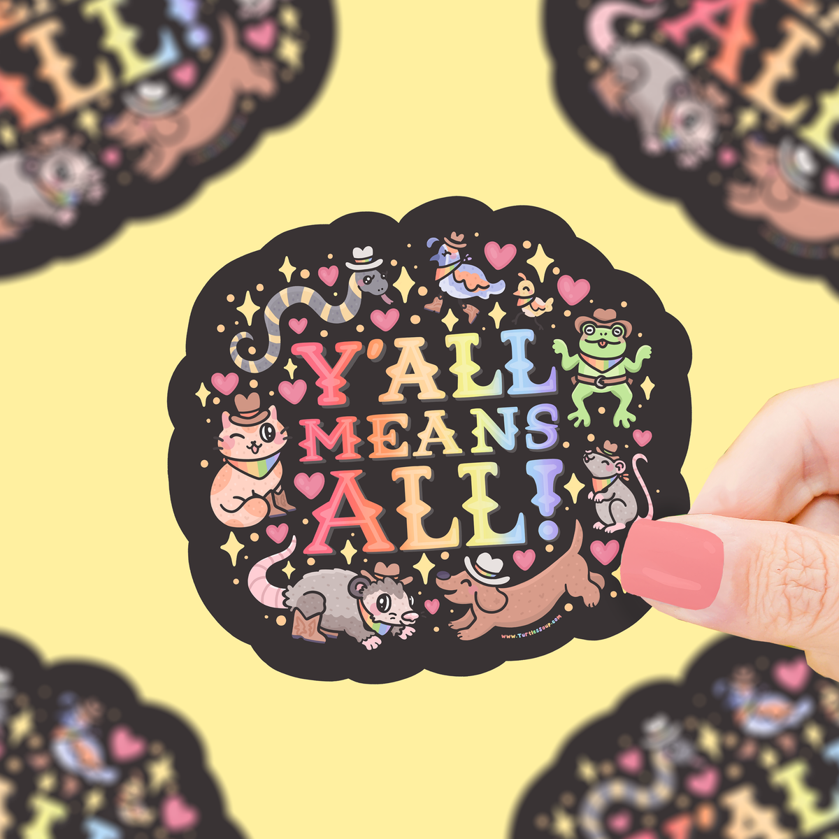 Black circular Y’all Means All pride vinyl sticker with colorful hearts and cartoon animals