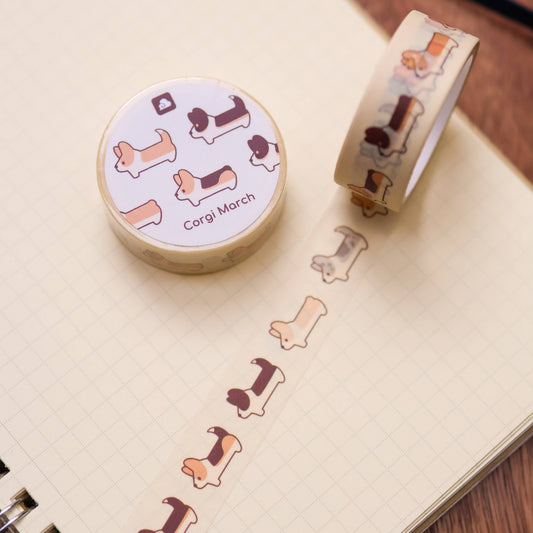 Washi tape roll with repeating corgi dog cartoon pattern, beige background and colorful dogs