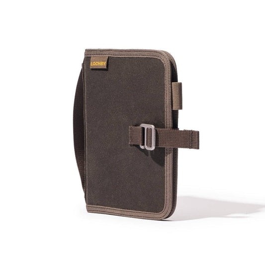 A6 field binder with dark front panel, tan trim, and side strap pocket
