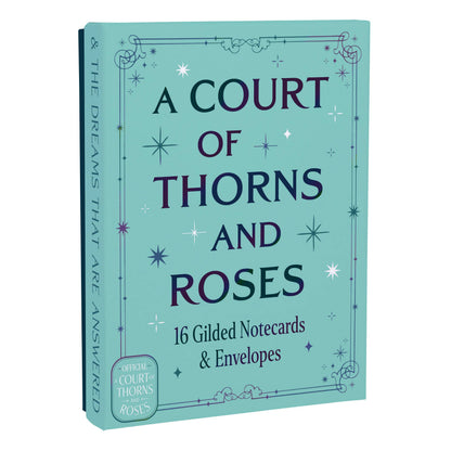 Teal gilded notecard box with gold title text and vertical spine quote