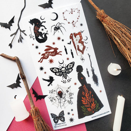 Dark fantasy sticker sheet with cat, raven, spider web, candles, and bat silhouettes