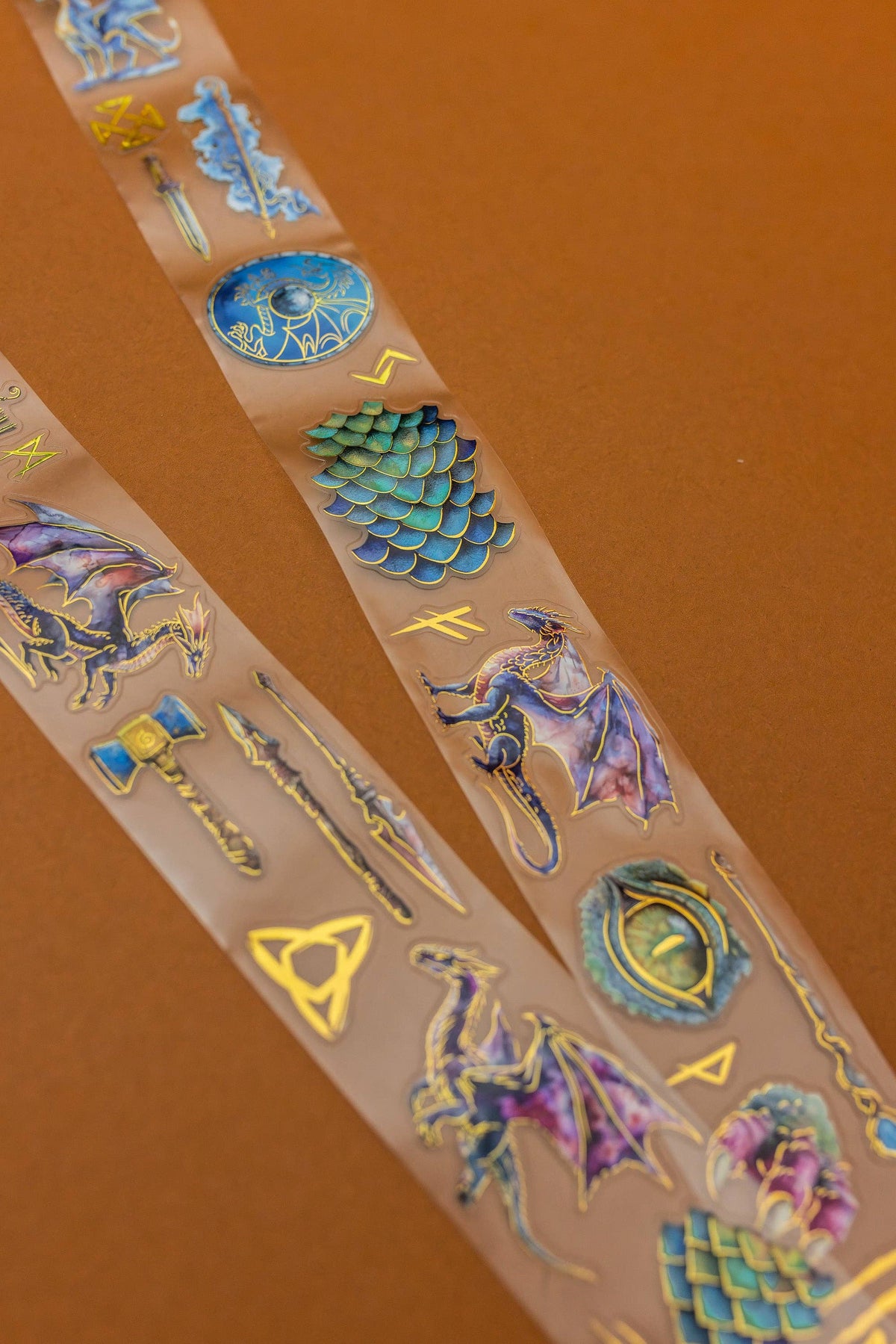 Dragon-themed transparent tape strip with holographic dragons, runes, and lightning