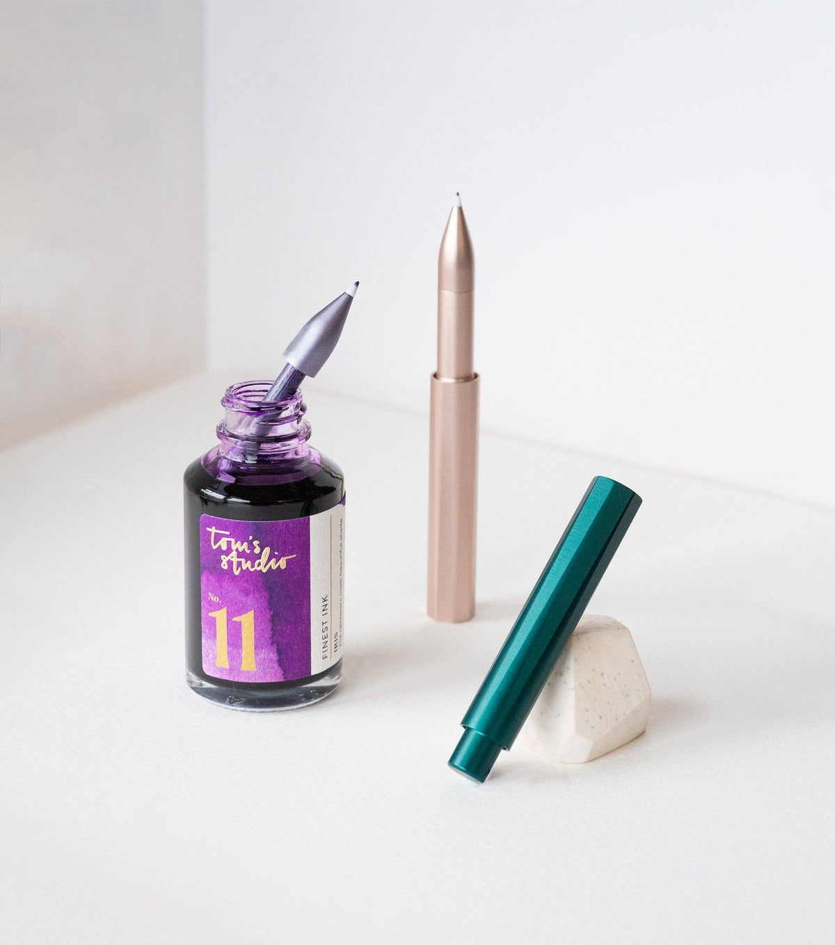 Refillable writing pen, rose-gold and teal barrels with metal nib tips