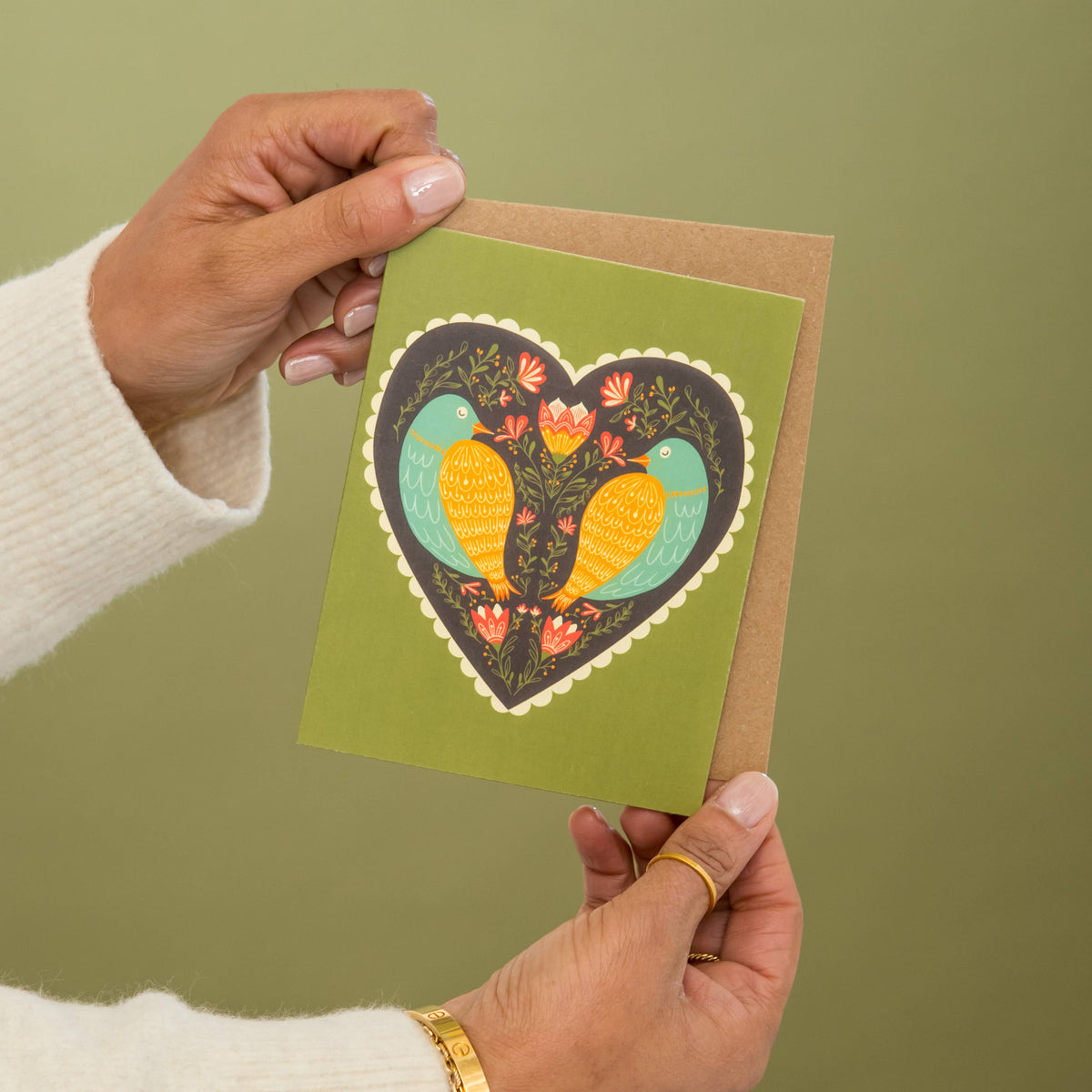 Bird-themed love card with a matching kraft envelope, held open for display