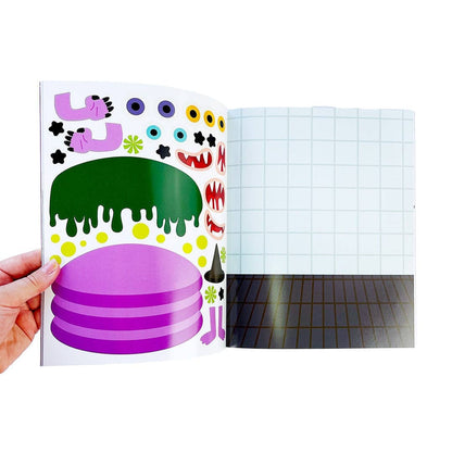 Open sticker activity book page with cartoon cakes, candles, and monster faces