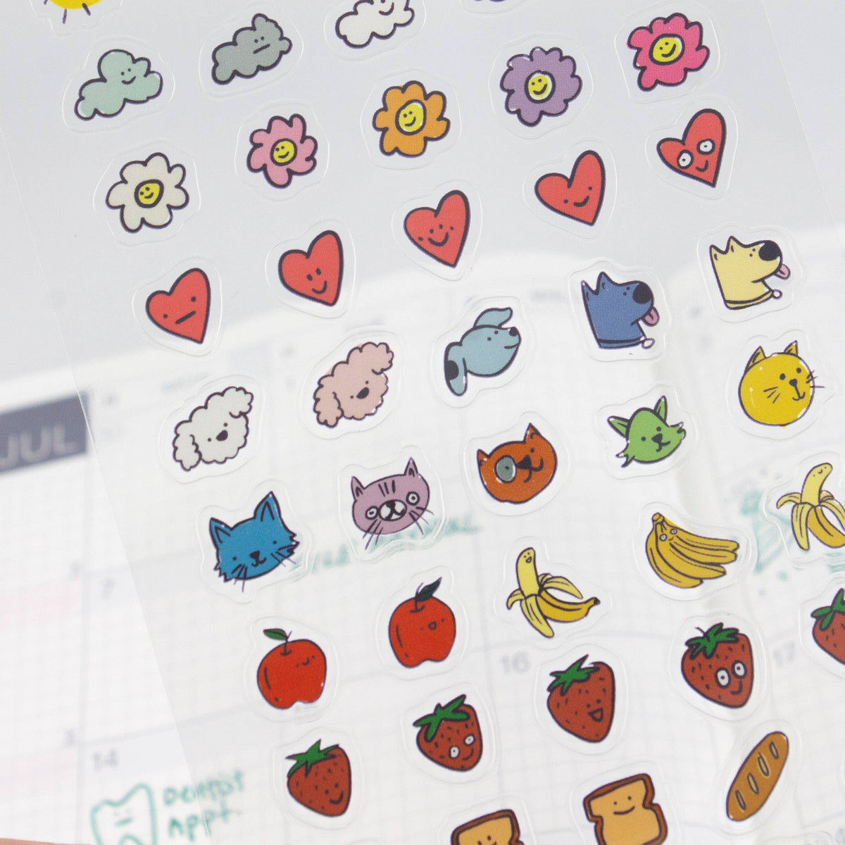 Clear planner sticker sheet with cat, strawberry, apple, and heart icons