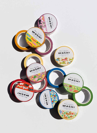 Assorted washi tape rolls with printed labels and colorful patterns, including dachshund designs