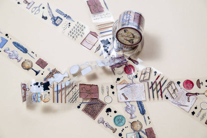 Decorative transparent tape with vintage office icons, shown rolled on core