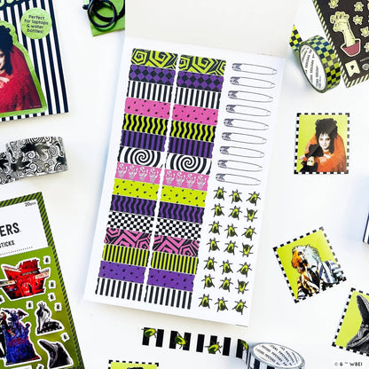 Sticker book page with colorful stripe bands and small green insect stickers
