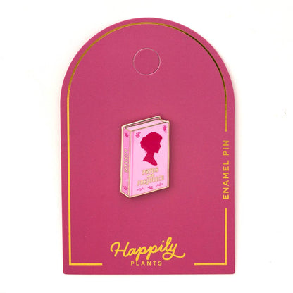 Maroon arch enamel pin holder with gold border and small pink book enamel pin.