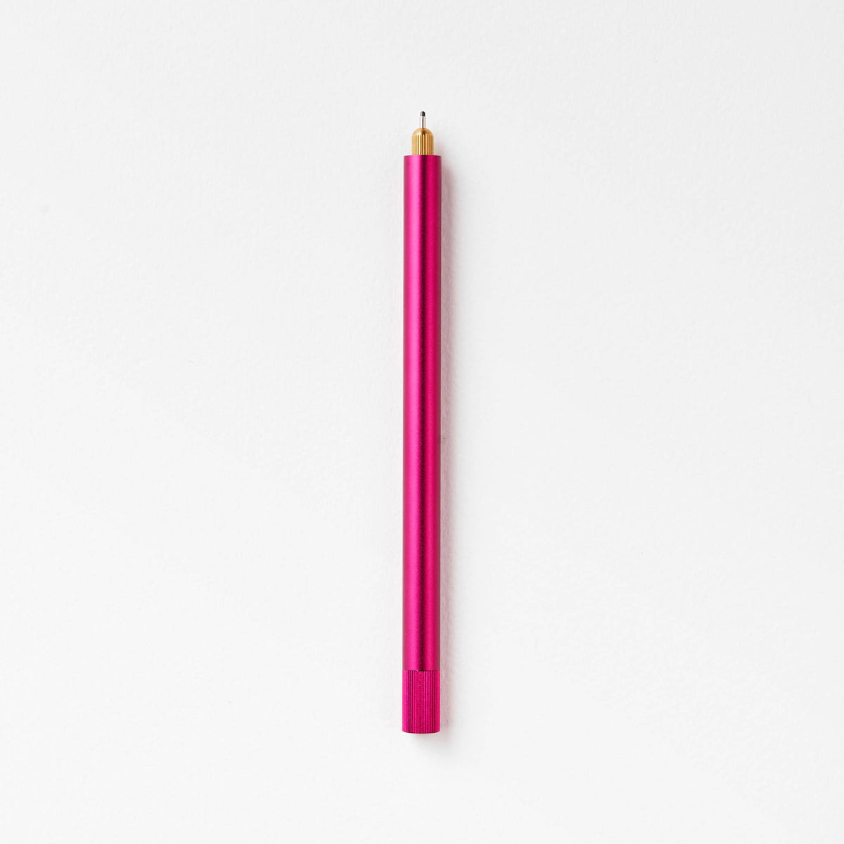 Refillable multi-tip pen with pink barrel and gold nib tip