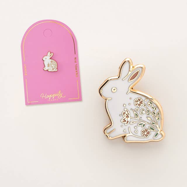 White rabbit enamel pin with gold outline and floral leaf detailing