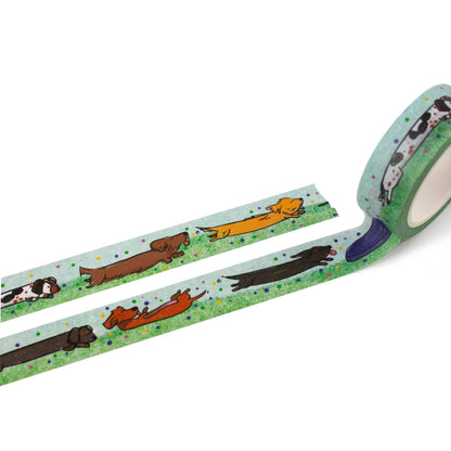 Illustrated green washi tape strip with dachshund pattern and confetti speckles