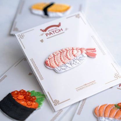 Japanese omelette embroidered iron-on patch on card with black seaweed stripe