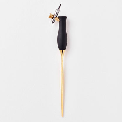 Calligraphy pen with oblique nib, dark handle and gold barrel