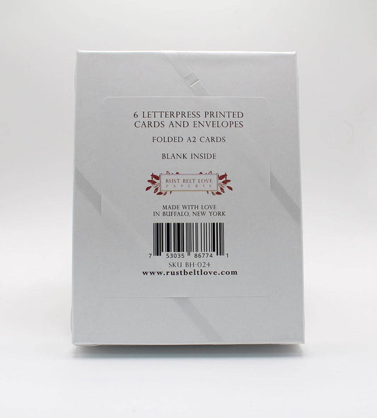 Boxed holiday letterpress card set with 6 printed cards and envelopes, blank inside