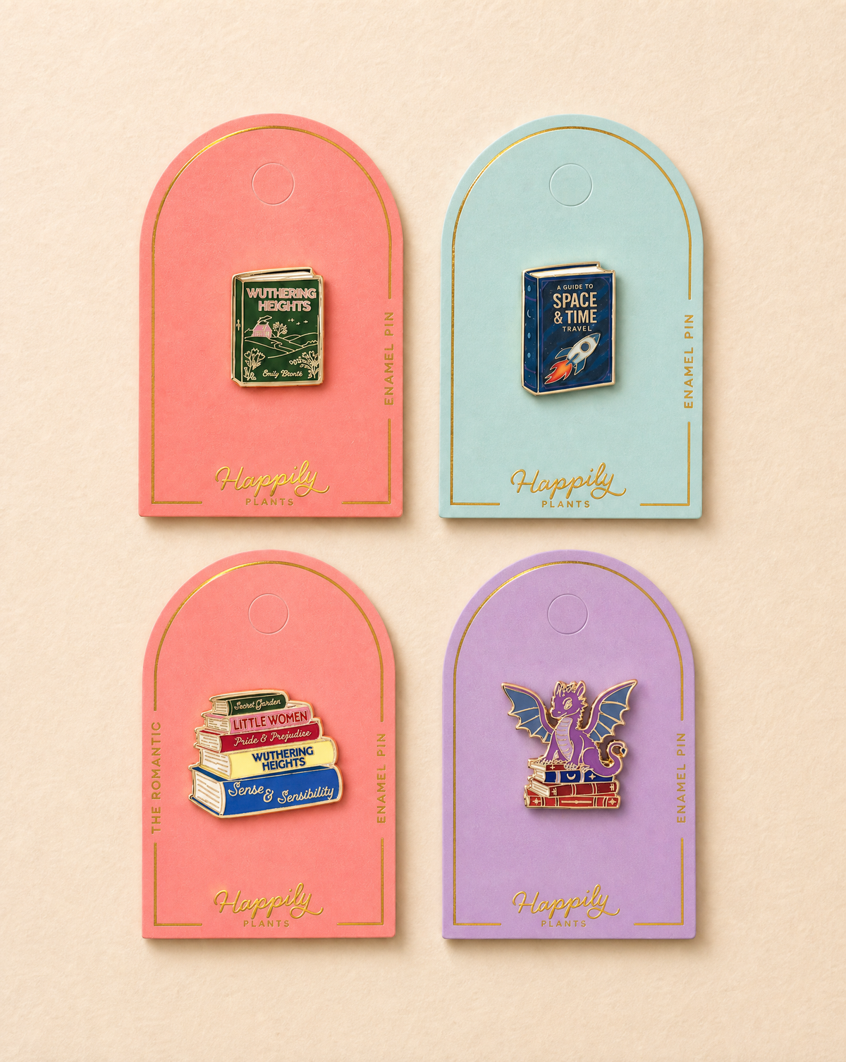 Four enamel book pins on arched cards, including green, blue, red, and purple designs