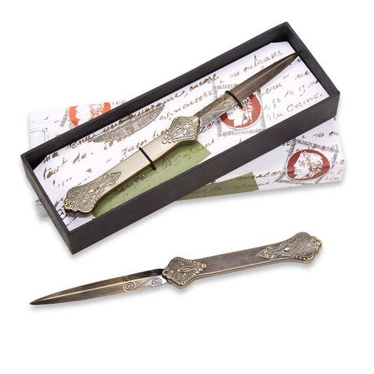 Vintage letter opener with ornate brass-toned handle, in dark presentation box