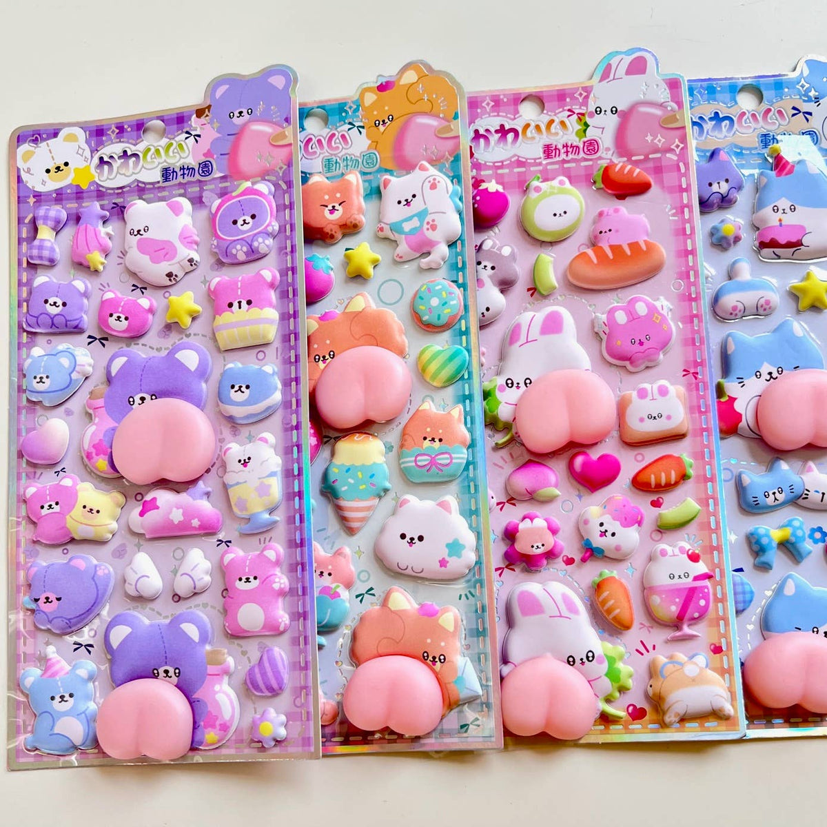 Animal squishy butt sticker set in four pastel card panels with many small character stickers