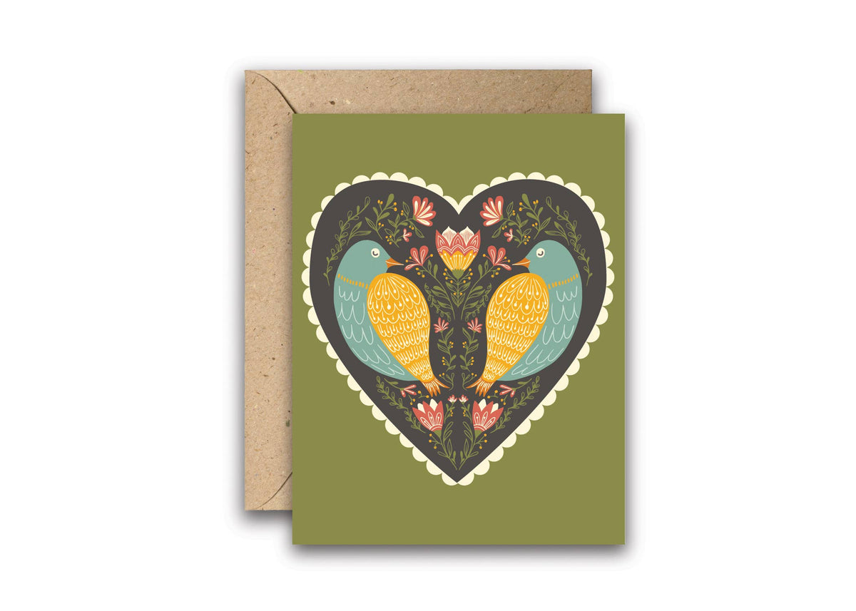 Romantic greeting card with two colorful birds facing each other inside a heart