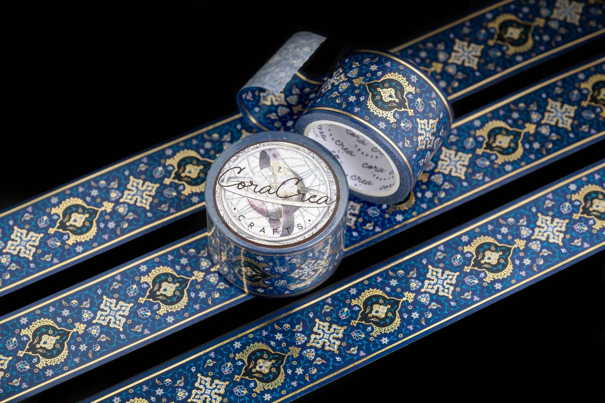 Blue foil washi tape roll and unrolled strip with gold ornate pattern