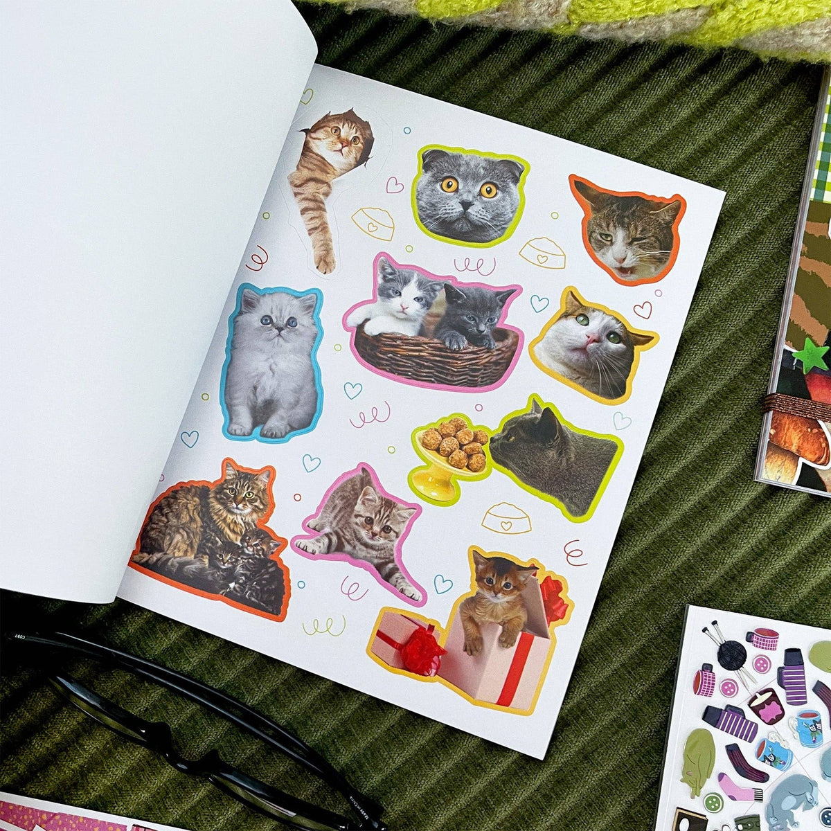 Cat sticker book page with white background and colorful cat stickers with doodles