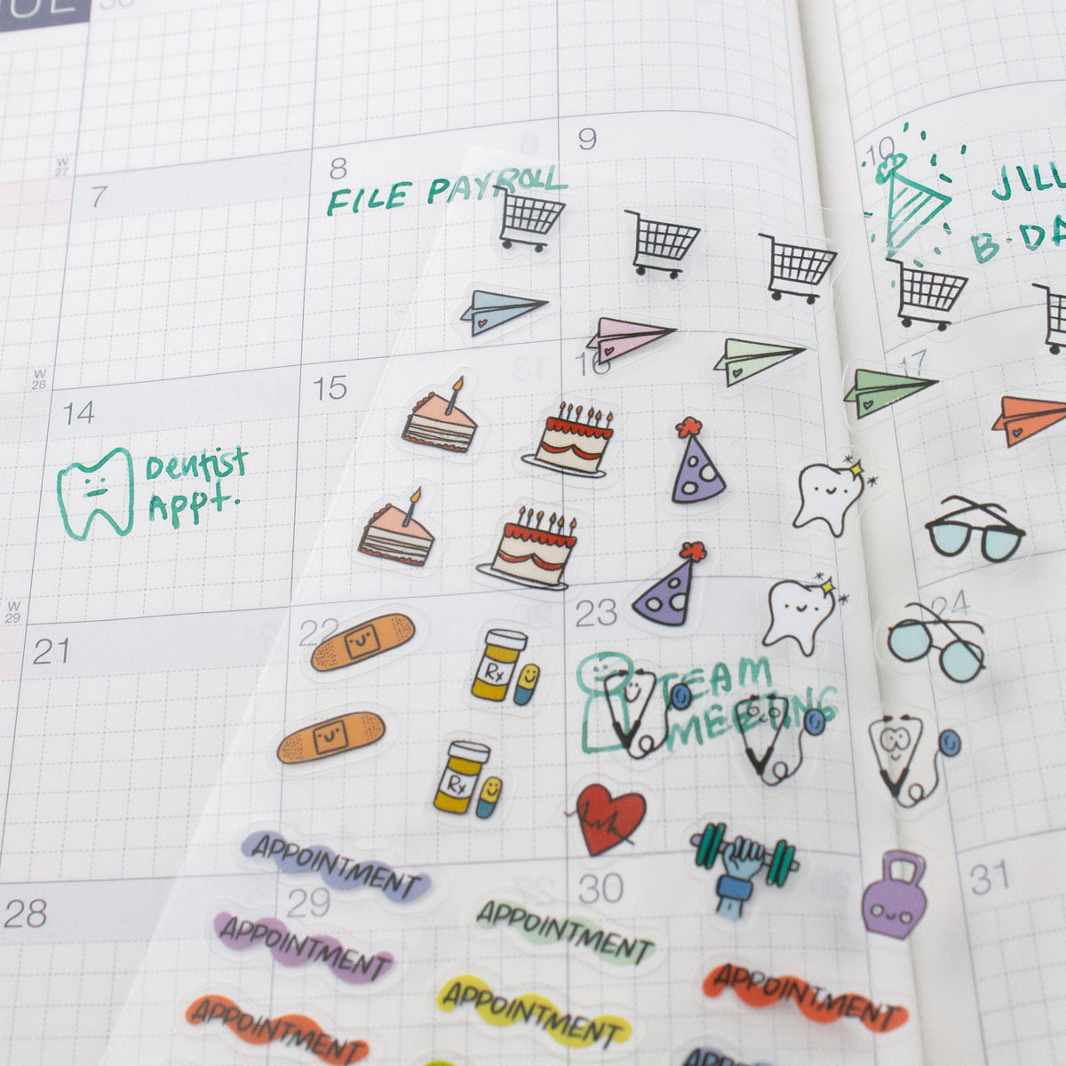 Planner page with applied stickers: shopping carts, cakes, heart icons, and appointment labels